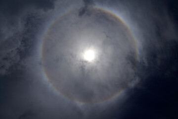 circular rainbow around the sun on the sky