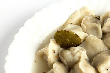 on a white background with pellets in the container