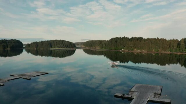 A float plane taxis in the lagoon before taking off in Kodiak, Alaska