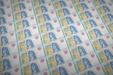 1000 Hungarian forint bills printed in illegal money production conveyor. Collage of many fake...