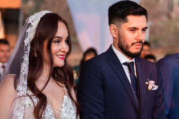 portrait of happy couple marrying redheaded woman to latin man