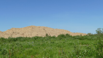 mountain of alluvial sand on the river Bank