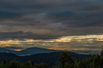 Fototapeta na wymiar View for valley under Mittagskogel hill in summer cloudy morning