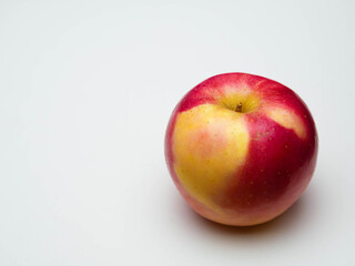 Whole ripe red apple on white background.
