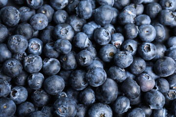 Fresh tasty blueberries as background, closeup view