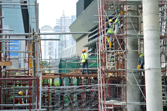 JOHOR, MALAYSIA -APRIL 13, 2016: Scaffolding used as the temporary structure to support platform, form work and structure at the construction site. Also used it as a walking platform for workers. 
