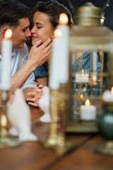 loving couple on romantic dinner through candle. 