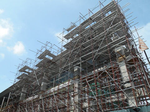 JOHOR, MALAYSIA -APRIL 13, 2016: Scaffolding used as the temporary structure to support platform, form work and structure at the construction site. Also used it as a walking platform for workers. 