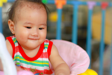 baby girl playing with toy