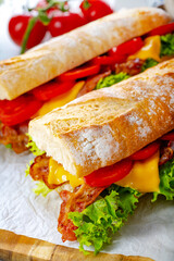 crispy baguette with bacon, tomatoes and cheese