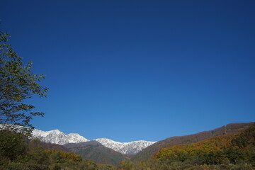 typical mountain landscape of Japanese alps in Hakuba at early Autumn