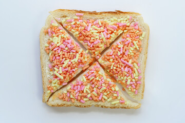 Open sweet sandwich with colored sprinkles called vruchten hagel.  Dutch food.