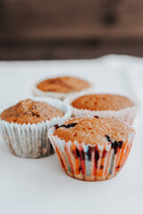 homemade muffins with different fillings on a light background. food for children's parties and tea