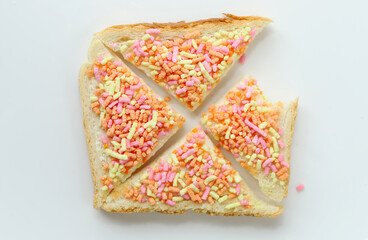 Open sweet sandwich with colored sprinkles called vruchten hagel.  Dutch food.