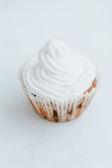 homemade veggie muffins with white cream on a light background.