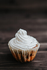 vegetarian muffins with white cream on a dark background.