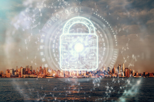 Lock icon hologram on city view with skyscrapers background multi exposure. Data security concept.