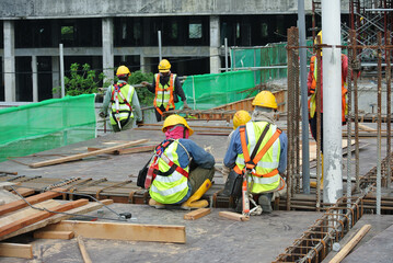 PERAK, MALAYSIA -APRIL 10, 2016: Construction workers fabricating timber form work mostly using timber and plywood at the construction site in Perak, Malaysia.  

