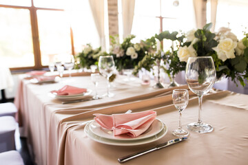 Close up of festive table setting with empty wine glasses