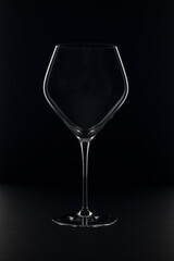 Wine glass on isolated black background.