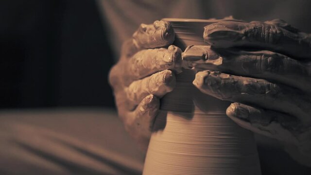 Woman's hands create Ceramic Pot