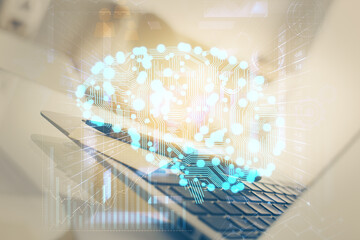 Double exposure of work space with computer and human brain drawing hologram. Brainstorm concept.