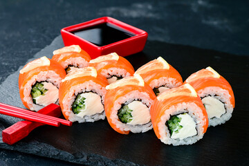 Philadelphia Maki Sushi made of Fresh Raw Salmon, Cream Cheese and Cucumber