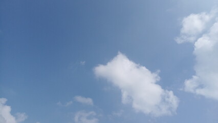 beautiful white clouds minimal in the blue sky, natural wallpaper, nature's background for printing back-cover designs and poster