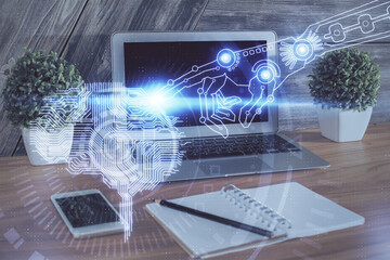 Multi exposure of work table with computer and brain hologram. Brainstorm concept.