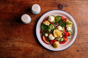 Tomato salad with cream cheese and sourdough bread croutons