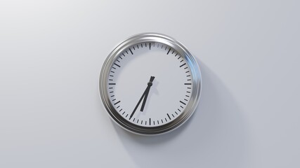 Glossy chrome clock on a white wall at thirty-five past six. Time is 06:35 or 18:35