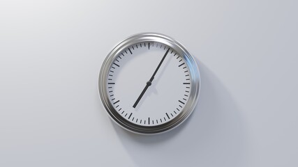 Glossy chrome clock on a white wall at five past seven. Time is 07:05 or 19:05