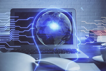 Multi exposure of work table with computer and brain hologram. Brainstorm concept.