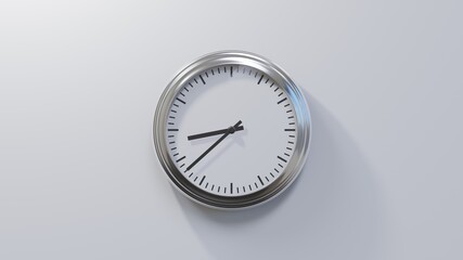 Glossy chrome clock on a white wall at thirty-eight past eight. Time is 08:38 or 20:38