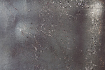 Grunge metallic texture background with solder spots.