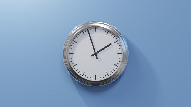 Glossy Chrome Clock On A Blue Wall At Fifty-seven Past One. Time Is 01:57 Or 13:57