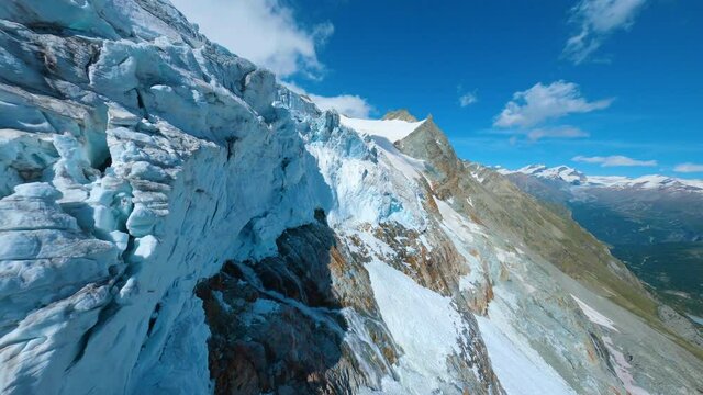 Flying Close To Rocky Cliffs With Hanging Glacier Ice -  Fast Diving Over The Waterfall Revealing The Stunning Matterhorn Summit In The Background In Zermatt, Switzerland. - FPV Aerial