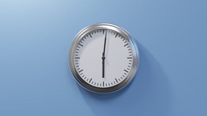 Glossy chrome clock on a blue wall at one past six. Time is 06:01 or 18:01