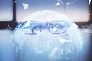 Business theme hologram with glasses on the table background. Concept of search. Double exposure.