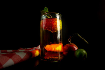 a glass of apple drink with an apple inside