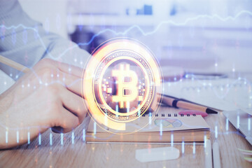Man's hands working with notes background. Cryptocurrency and finance concept.