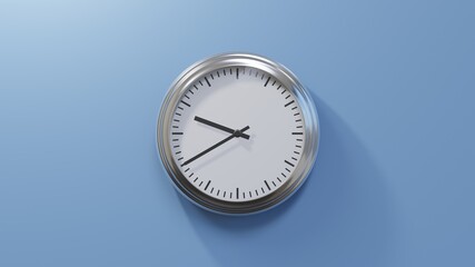 Glossy chrome clock on a blue wall at twenty to ten. Time is 09:40 or 21:40