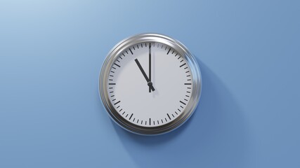 Glossy chrome clock on a blue wall at eleven o'clock. Time is 11:00 or 23:00