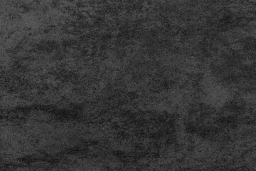 Black concrete stone texture for background in black.  Cement and sand grey dark detail covering.