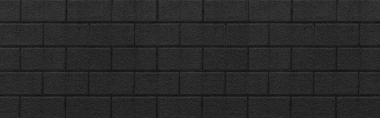 Obraz premium Panorama of Black stone block wall seamless background and pattern texture