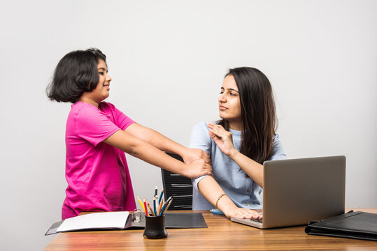 Work From Home Concept - Indian Mother Or Mom Working While Cute Little Daughter Is Around