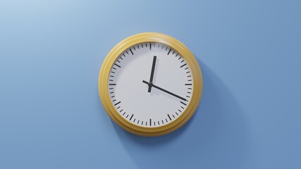 Glossy orange clock on a blue wall at nineteen past twelve. Time is 00:19 or 12:19