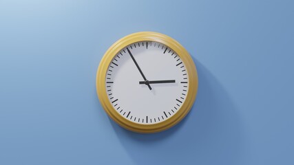 Glossy orange clock on a blue wall at five to three. Time is 02:55 or 14:55