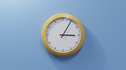 Glossy orange clock on a blue wall at five past three. Time is 03:05 or 15:05
