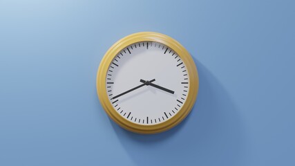 Glossy orange clock on a blue wall at forty-one past three. Time is 03:41 or 15:41